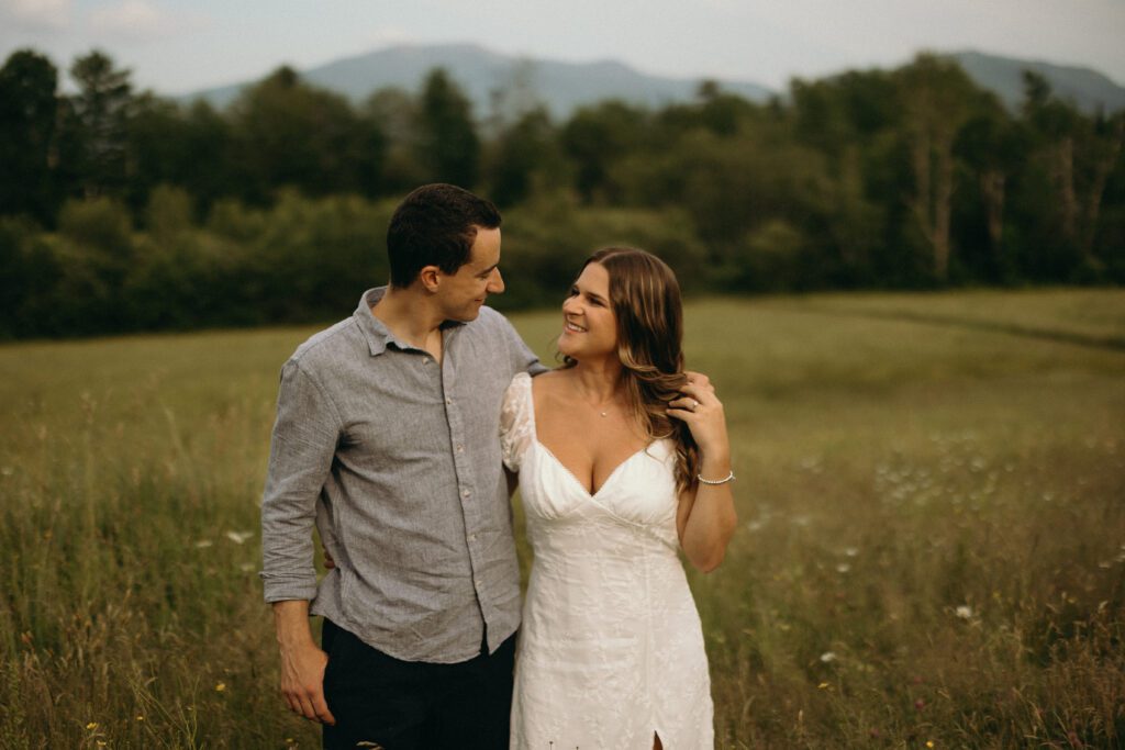 man and woman smiling at each other 