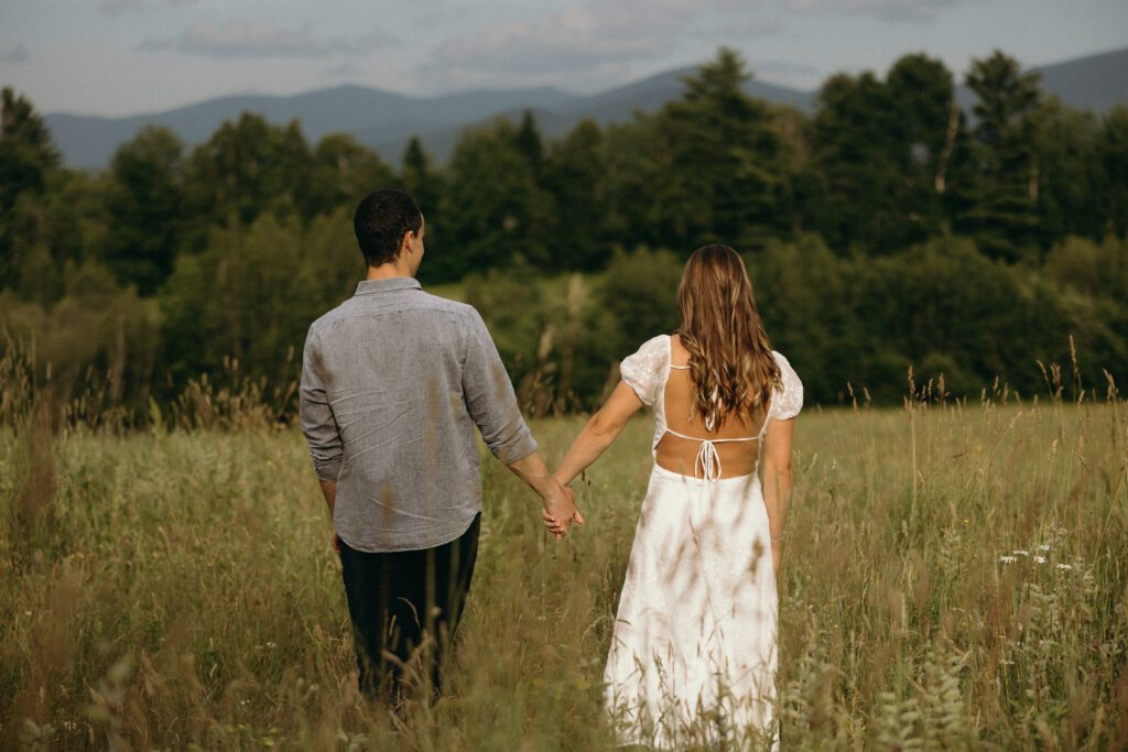 man and woman looking at mountains