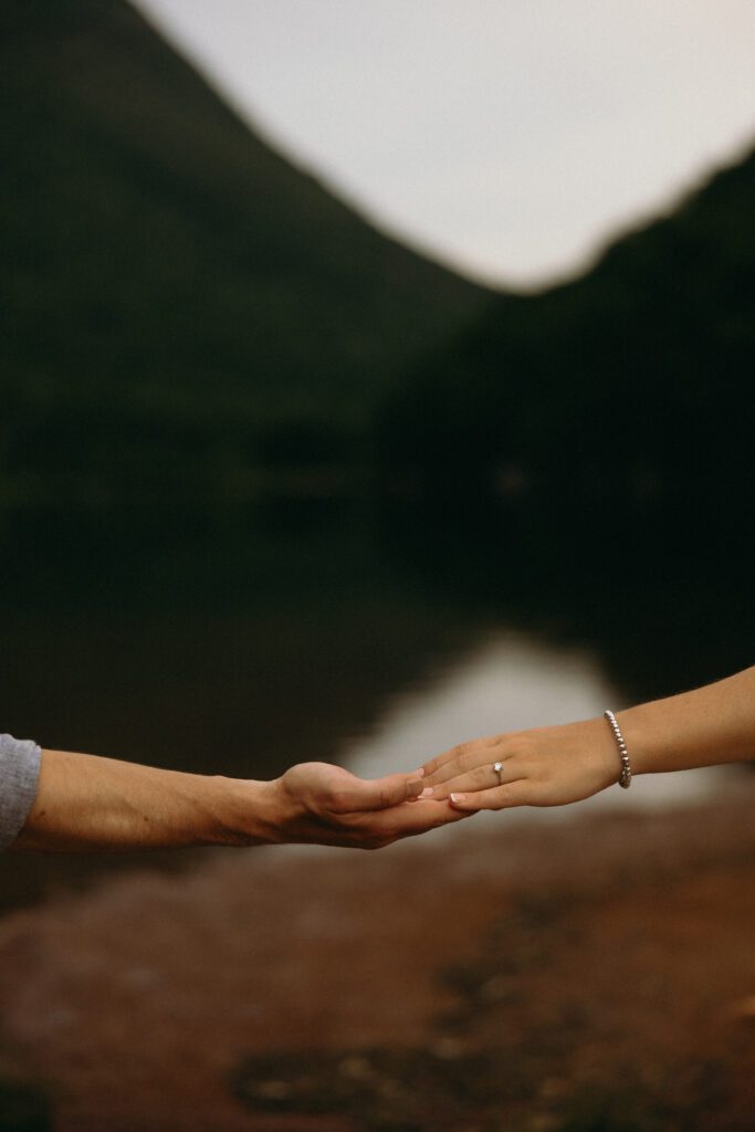 man and woman holding each others hands 
